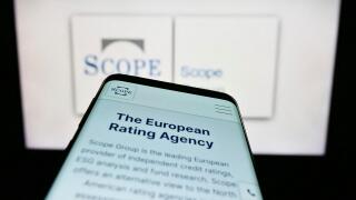 Stuttgart, Germany, 03-13-2023: Smartphone with website of European fund rating company Scope Group on screen in front of business logo. Focus on