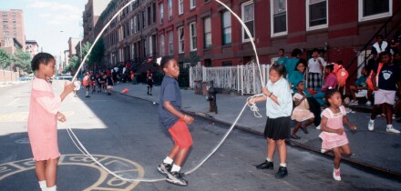 Young girls practice their double dutch skills on a Harlem play street. Image shot 1994. Exact date unknown.