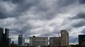 View of apartments and office buildings on Albert Embankment in London on cloudy day.