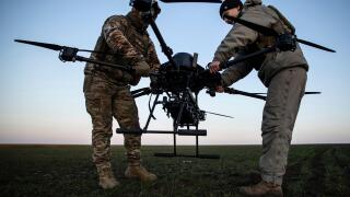 Ukrainian servicemen prepare a Vampire attack drone near the front line in the Donetsk region, Ukraine, Saturday, Feb. 8, 2025. (AP Photo/Roman Chop)