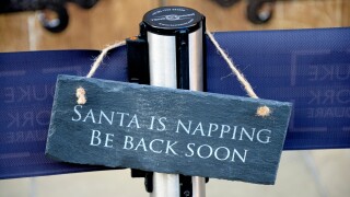 London, England, UK. 'Santa is Napping' sign outside Santa's Grotto Chelsea