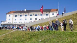 Rigi Kulm hotel and restaurant at the top of Rigi mountain in Switzerland, crowd of tourists ascending from the railway station