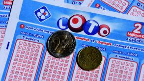 In this photo illustration, coins seen on Lotto tickets.
La Francaise des Jeux celebrated the 45th anniversary of its flagship lottery on May 19, 2021, with a super jackpot of 13 million euros. (Photo by Gerard Bottino / SOPA Images/Sipa USA)