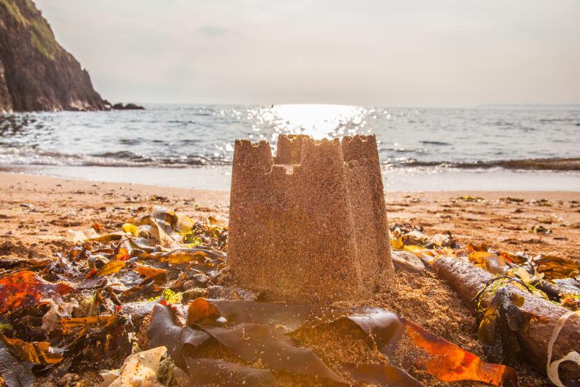 Sand castle on Hope Cove beach, Devon, England, United Kingdom.
