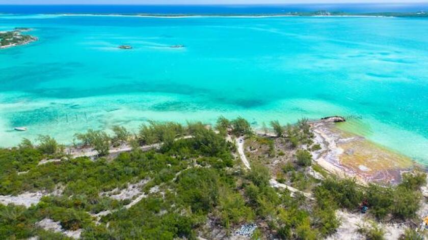 Some of the 30,000 gallons of fuel spilled by a vessel named The Arabian is caught on the shore of Great Exuma near Old Navy Base in George Town, Bahamas July 20, 2022. REUTERS/Reno Curling
