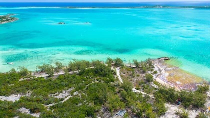 Some of the 30,000 gallons of fuel spilled by a vessel named The Arabian is caught on the shore of Great Exuma near Old Navy Base in George Town, Bahamas July 20, 2022.  REUTERS/Reno Curling