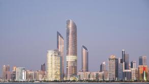 Skyline of modern buildings along Corniche waterfront in Abu Dhabi United Arab Emirates