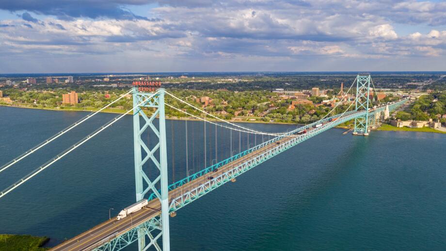 Detroit, Michigan - The Ambassador Bridge, linking the United States (foreground) and Canada over the Detroit River.