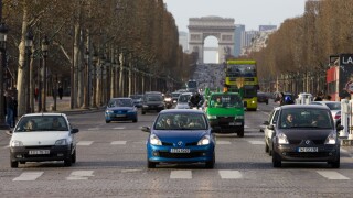 Three Renault French cars stop at pedestrian crossing on Champs lys es Paris France