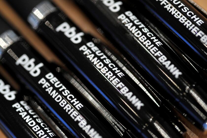 Pens printed with the writing 'Deutsche Pfandbriefbank' are seen during the financial statements press conference of Hypo Real Estate (HRE) in Munich, Germany, 01 March 2012. The commercial property lender presented its balance sheets of 2011. Photo: FRAN