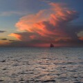 View of sloop on the horizon at sunset, Boracay, Philippines, Asia
