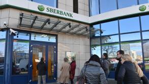 Brno, Cr . 25th Feb, 2022. People stand in a queue in front of the branch of Sberbank CZ, which has links to Russia, in Brno, Czech Republic, February 25, 2022. Bank closed its branches in Czechia at 14:00, bank spokeswoman Radka Cerna told CTK, citing se