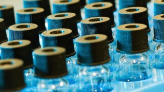 Edmonton, Alberta, Canada; Small Glass Bottles With Black Lids In A Labratory