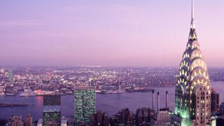 Chrysler Building illuminated evening sky. United Nations Building Commercial real estate The East River New York City skyline from above, Midtown USA