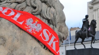 Poland scarf on a statue in Warsaw at Euro 2012