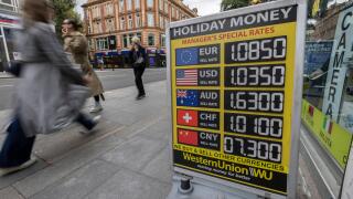 Holiday Money exchange rates advertised outside a bureau de change as the British pound hit a record low to $1.03, Tottenham Court Road, London, UK