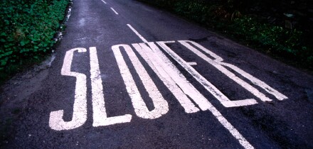 Slower Road Sign