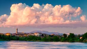 Urago d'Oglio, Po valley, Brescia, Italy, Sunset and big cloud on village