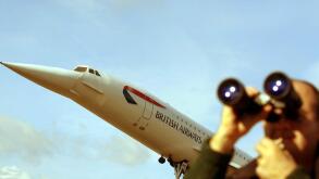 A keen plane spotter at the stands under the model of Concorde at Heathrow, London terminal awaiting the arrival of the final Concorde flight arriving at Heathrow airport, from New York, marking the end of an era of supersonic travel. * The big bird, pack