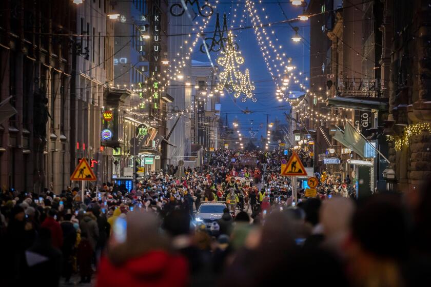 Helsinki, Finland. 19th Nov, 2022. People participate in the Christmas opening celebration in Helsinki, Finland, Nov. 19, 2022. The Christmas opening celebration was held in central Helsinki on Saturday with a glittering parade, marking the start of the f