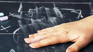 Hand erased scheme football game from blackboard background