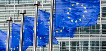EU flags in front of European Commission in Brussels