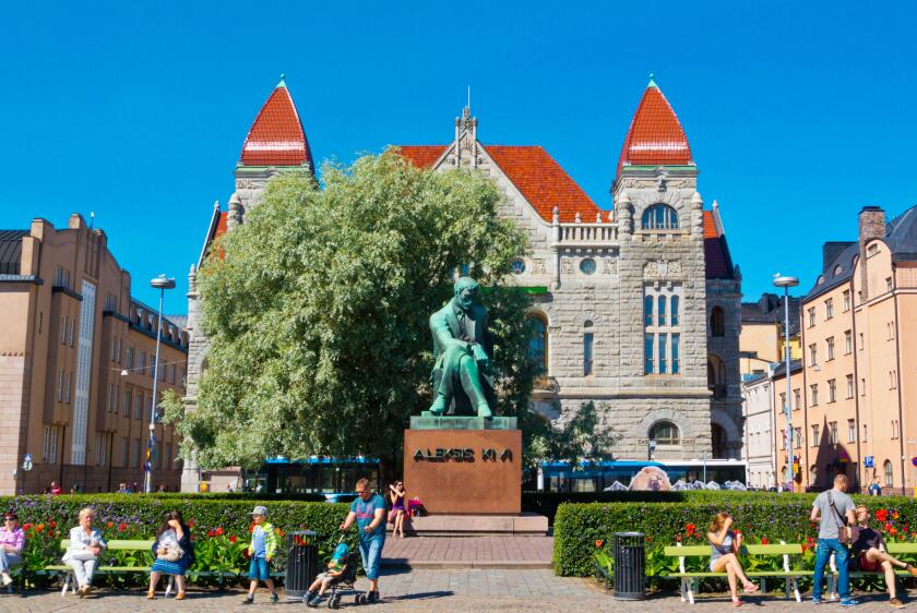 Suomen Kansallisteatteri, National Theatre, with Aleksis Kivi memorial, Rautatientori,  Helsinki, Finland