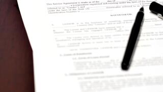 Loan document and agreement with pen for signing