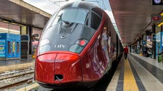 Red High-Speed Train - Front view of a red modern high-speed electric train, Alstom AGV 575 of NTV, parking in Rome Termini Train Station. Rome, Italy.