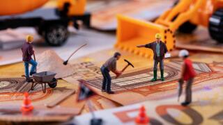 construction business concept - workers team working hard to earn more money