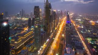 Skyscrapers along Sheikh Zayed Road at evening rush hour, Dubai, UAE