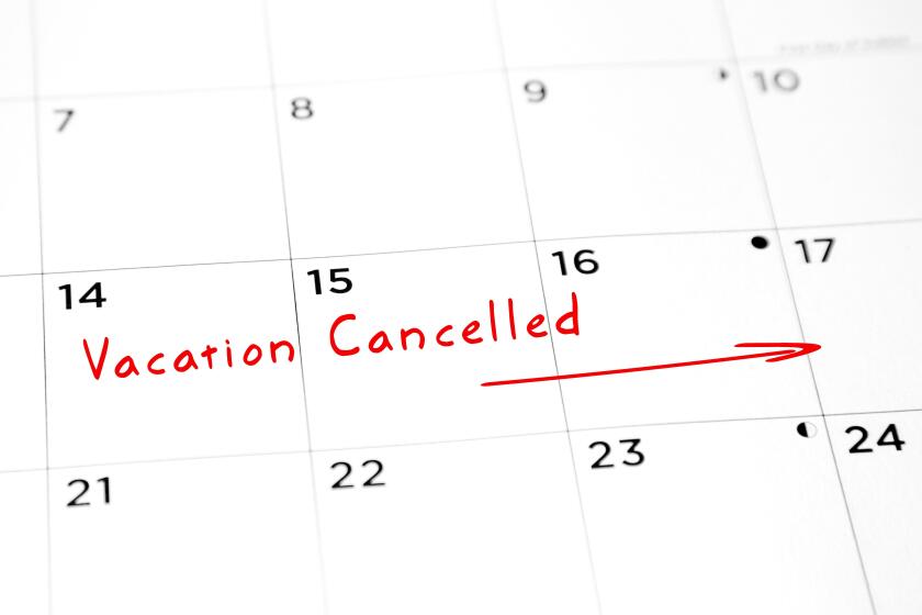 Vacation cancelled written in red marker on a calendar.