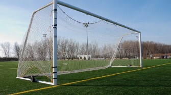 Wheeled mobile goalposts and net on a soccer pitch in Toronto Ontario Canada