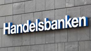 Aarhus, Denmark - August 7, 2020: Handelsbanken logo on a wall. Handelsbanken is a Swedish bank providing universal banking services