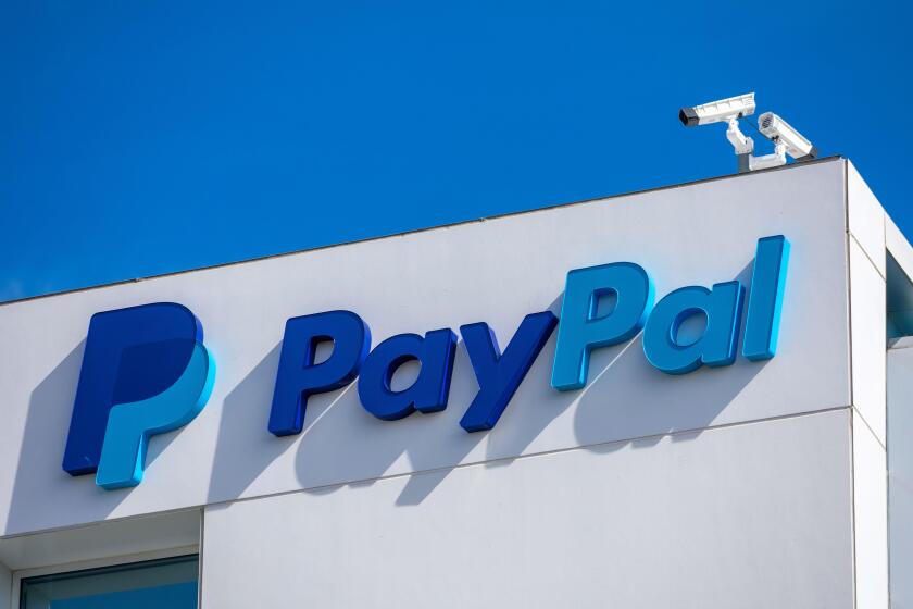 PayPal logo and sign at company headquarters building facade in Silicon Valley. PayPal Holdings Inc. is an American company operating a worldwide onli