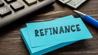 Business concept meaning REFINANCE with sign on the sheet.