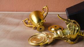 High Angle View Of Broken Trophy On Table