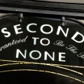 ' Second to None Guaranteed to be the Best ' sign on shop window