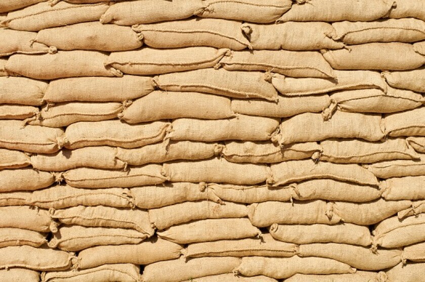 Wall of sandbags from Alamy 13Apr22 575x375