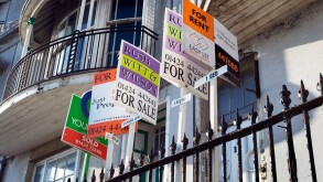 Estate Agents For Sale For Rent and Sold signs outsde Victorian houses in Pelham Crescent on the seafront in Hastings Sussex