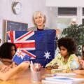 students listen to woman teacher who talks about Australia