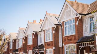 Street of typical terraced houses - London UK