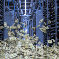 A bill pile of cash superimposed in front of a data centre server room