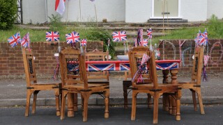Wooden Table And Chairs Decorated With Union Jack Flags Ready For Street Party Celebrating The Queen's Diamond Jubilee