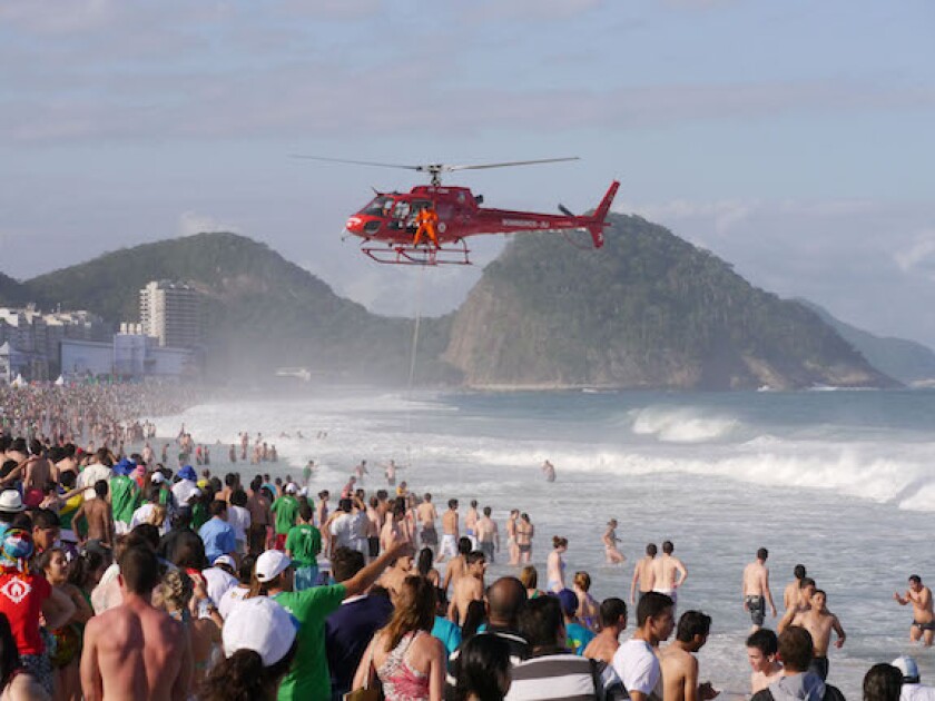 Helicopter rescuing people from the rough seas of Copacabana Beach, Brazil, LatAm, choppy, volatile, 575