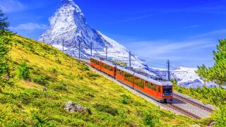 Zermatt, Switzerland. Gornergrat tourist train with Matterhorn mountain in the background. Valais region.