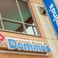 Orlando Florida,UCF University of Central Florida campus,Domino's Pizza restaurant,fast food chain,storefront signage logo,outside exterior,branding p