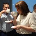 Britain's Chancellor of the Exchequer Rachel Reeves, center, Britain's Health Secretary Wes Streeting, left, and Britain's Prime Minister Keir Starmer hold hot drinks as they talk with Nurses during a visit to University College London Hospital in London,
