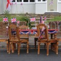 Wooden Table And Chairs Decorated With Union Jack Flags Ready For Street Party Celebrating The Queen's Diamond Jubilee