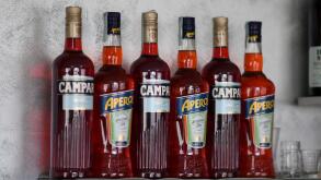 Cremona, Italy July 19th 2025 Several bottles of Campari and Aperol, two famous italian aperitifs, are standing on a bar shelf, ready to be served